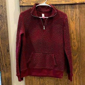 This is a medium maroon NOBO pull over